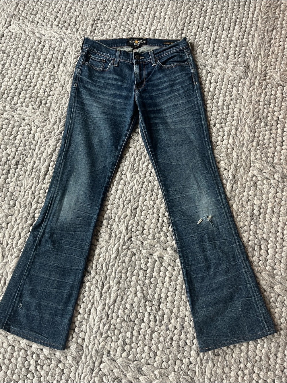 Lucky “Sweet ‘N Low” bootcut cut distressed jeans